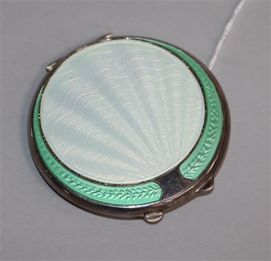 A 1940s Art Deco silver and enamel circular compact, 67mm.